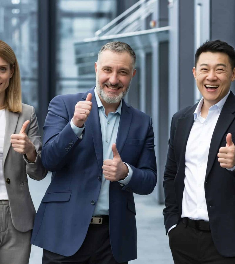 cheerful-dream-team-senior-and-experienced-it-professionals-in-business-suits-smiling-and-happy.jpg